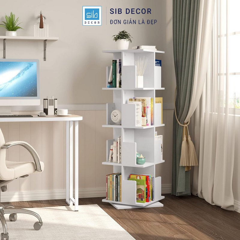 Kệ sách xoay 360 độ màu trắng bố trí cạnh bàn làm việc, hỗ trợ lưu trữ hiệu quả