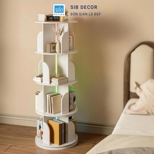 Tủ sách xoay màu trắng đặt cạnh giường, giúp lưu trữ sách và decor tiện lợi