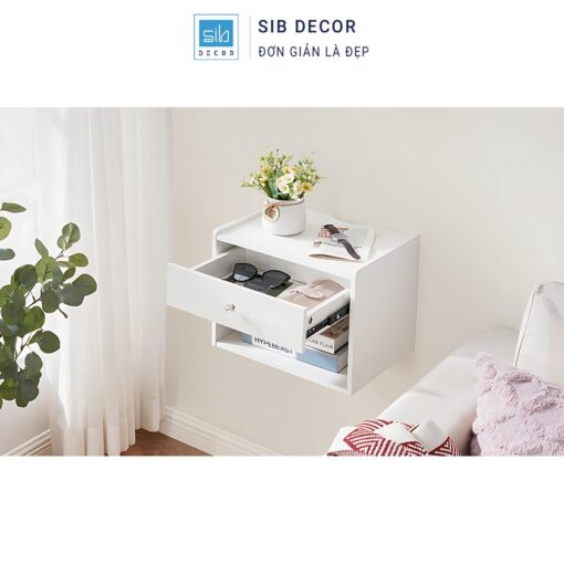 Kệ đầu giường treo tường trắng trang nhã, ngăn kéo và kệ dưới giúp lưu trữ sách tiện lợi